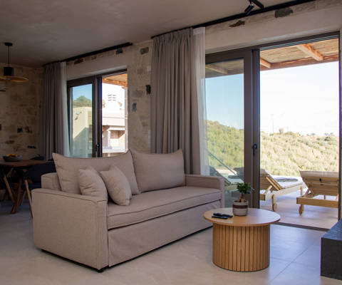 Comfortable Living room next to the balcony door leading to the pool area